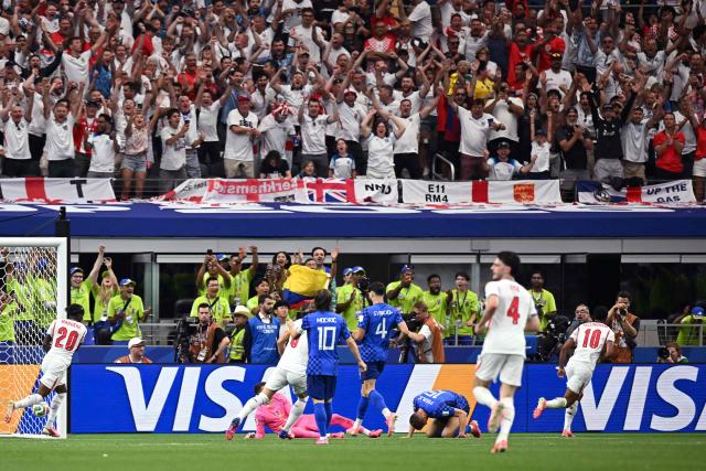 England's midfielder #10 Jude Bellingham (R) celebrates after scoring his team's third goal during the 2026 World Cup Group L football match between England and Croatia at the Dallas Stadium in Arlington on June 17, 2026.  (Photo by Paul ELLIS / AFP)