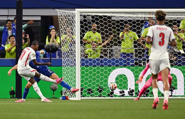 England's forward #11 Marcus Rashford (L) shoots and scores his team's fourth goal during the 2026 World Cup Group L football match between England and Croatia at the Dallas Stadium in Arlington on June 17, 2026.  (Photo by Paul ELLIS / AFP)