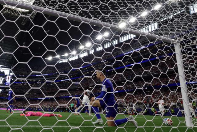 Croatia's forward #14 Ivan Perisic (C) reacts after his team conceded a fourth goal during the 2026 World Cup Group L football match between England and Croatia at the Dallas Stadium in Arlington on June 17, 2026.  (Photo by Aric Becker / AFP)