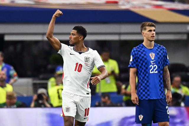 (FILES) England's midfielder #10 Jude Bellingham celebrates after scoring his team's third goal during the 2026 World Cup Group L football match between England and Croatia at the Dallas Stadium in Arlington on June 17, 2026.  (Photo by Paul ELLIS / AFP)