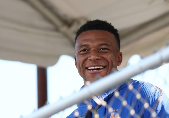 France's forward #10 Kylian Mbappe smiles during a training session at Bentley University, the team's base camp, during the 2026 World Cup football tournament in Waltham, near Boston, on June 17, 2026. (Photo by FRANCK FIFE / AFP)
