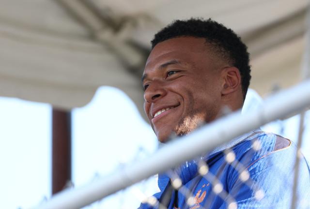 France's forward #10 Kylian Mbappe smiles during a training session at Bentley University, the team's base camp, during the 2026 World Cup football tournament in Waltham, near Boston, on June 17, 2026. (Photo by FRANCK FIFE / AFP)