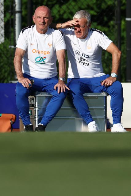 France's head coach Didier Deschamps (R) and his assistant Guy Stephan attend a training session at Bentley University, the team's base camp, during the 2026 World Cup football tournament in Waltham, near Boston, on June 17, 2026. (Photo by FRANCK FIFE / AFP)