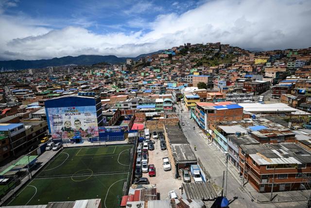 This aerial view shows Ciudad Bolivar neighbourhood, in southern Bogota, on June 17, 2026. Colombians vote on June 21, 2026 in a presidential runoff pitting a hard-right opera-singer-turned-lawyer against a leftist senator, an election with stark consequences for the country's stumbling peace process with armed groups and strained ties with Washington. (Photo by Juan BARRETO / AFP)