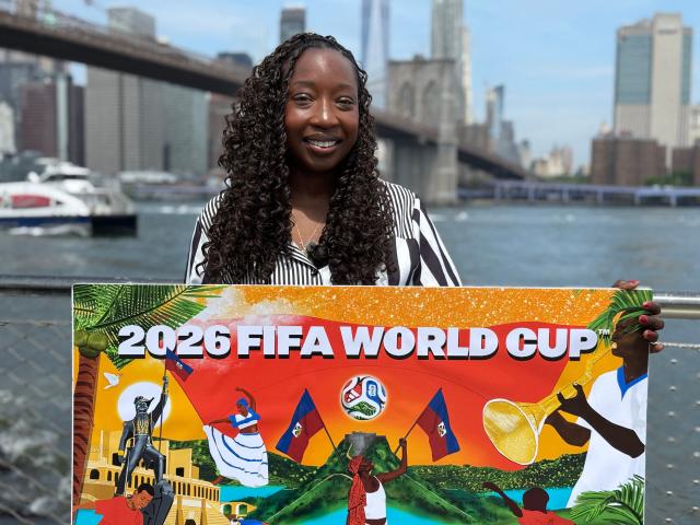 Lyne Lucien, Haitian artist based in Brooklyn, holds the illustration she created for the Fox Sports Global Artist Series, a collaborative World Cup-themed creative project, in Brooklyn, New York, on June 10, 2026. Threatened by Donald Trump’s immigration policy, Haitians in New York find a rare source of joy in their country’s participation in its first World Cup since 1974, ahead of facing an admired Brazilian team on June 19. (Photo by Diane DESOBEAU / AFP)