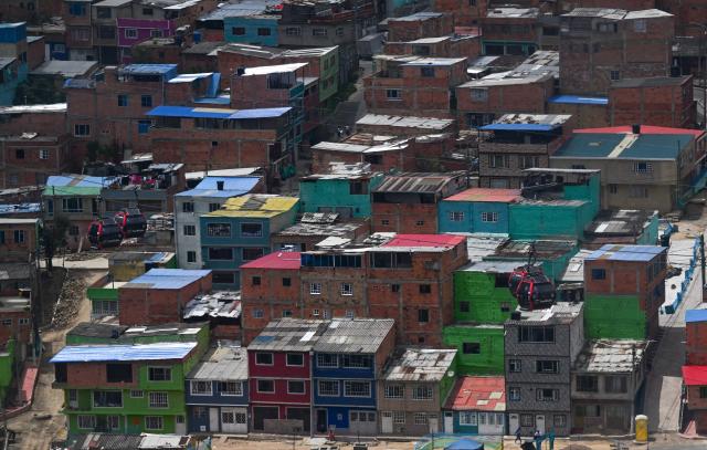 This image shows lower-middle-income housing at Ciudad Bolivar neighbourhood, in southern Bogota, on June 17, 2026. Colombians vote on June 21, 2026 in a presidential runoff pitting a hard-right opera-singer-turned-lawyer against a leftist senator, an election with stark consequences for the country's stumbling peace process with armed groups and strained ties with Washington. (Photo by Juan BARRETO / AFP)