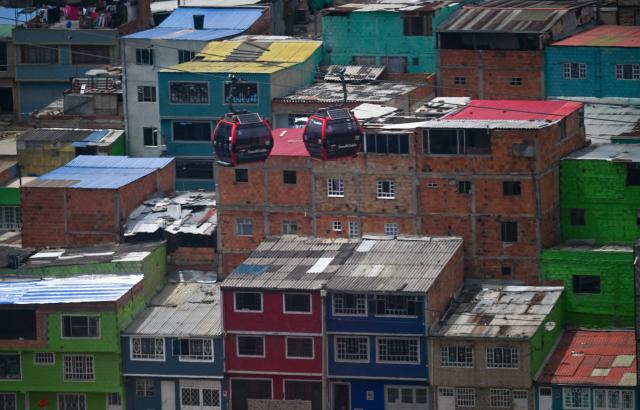 This image shows lower-middle-income housing at Ciudad Bolivar neighbourhood, in southern Bogota, on June 17, 2026. Colombians vote on June 21, 2026 in a presidential runoff pitting a hard-right opera-singer-turned-lawyer against a leftist senator, an election with stark consequences for the country's stumbling peace process with armed groups and strained ties with Washington. (Photo by Juan BARRETO / AFP)