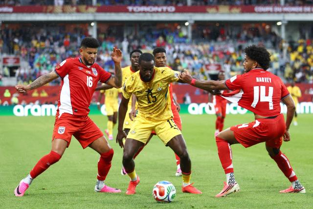 Panama's defender #16 Andres Andrade, Ghana's midfielder #15 Elisha Owusu and Panama's midfielder #14 Carlos Harvey fight for the ball during the 2026 World Cup Group L football match between Ghana and Panama at the Toronto Stadium in Toronto on June 17, 2026.  (Photo by Cole Burston / AFP)
