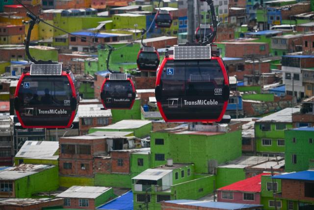 This image shows cable cars at Ciudad Bolivar neighbourhood, in southern Bogota, on June 17, 2026. Colombians vote on June 21, 2026 in a presidential runoff pitting a hard-right opera-singer-turned-lawyer against a leftist senator, an election with stark consequences for the country's stumbling peace process with armed groups and strained ties with Washington. (Photo by Juan BARRETO / AFP)