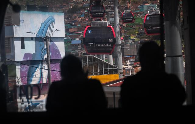 This image shows cable cars at Ciudad Bolivar neighbourhood, in southern Bogota, on June 17, 2026. Colombians vote on June 21, 2026 in a presidential runoff pitting a hard-right opera-singer-turned-lawyer against a leftist senator, an election with stark consequences for the country's stumbling peace process with armed groups and strained ties with Washington. (Photo by Juan BARRETO / AFP)