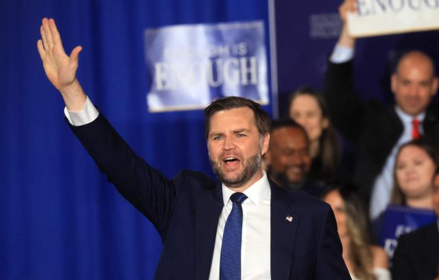 US Vice President JD Vance gestures as he arrives to deliver remarks on the administration's "crackdown on crime and fraud" during an event at Gold Coast Studios in Bethpage, New York, on June 17, 2026. Vance’s visit comes after the Justice Department filed a lawsuit this week against New York state officials over alleged Medicaid fraud related to the state’s $10 billion home-care program. (Photo by Spencer Platt / POOL / AFP)