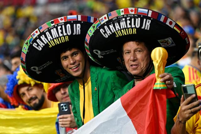 Mexican fans pose for a photo ahead of the 2026 World Cup Group K football match between Uzbekistan and Colombia at the Mexico City Stadium in Mexico City on June 17, 2026.  (Photo by Alfredo ESTRELLA / AFP)