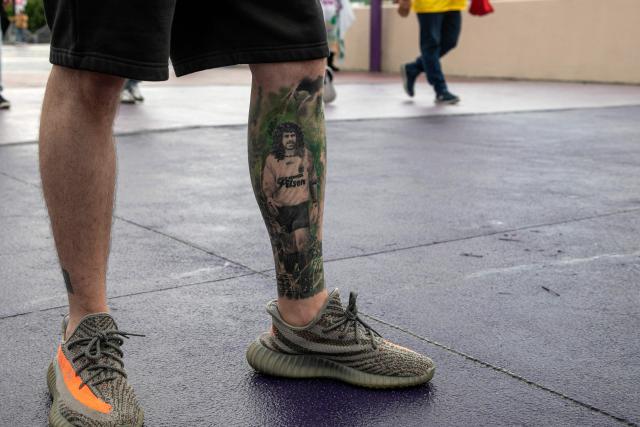 A tattoo depicting former Colombian goalkeeper Rene Higuita is seen on the leg of a Colombia fan outside the Mexico City Stadium ahead of the 2026 World Cup Group K football match between Uzbekistan and Colombia in Mexico City on June 17, 2026. (Photo by Oswaldo Ramirez / AFP)