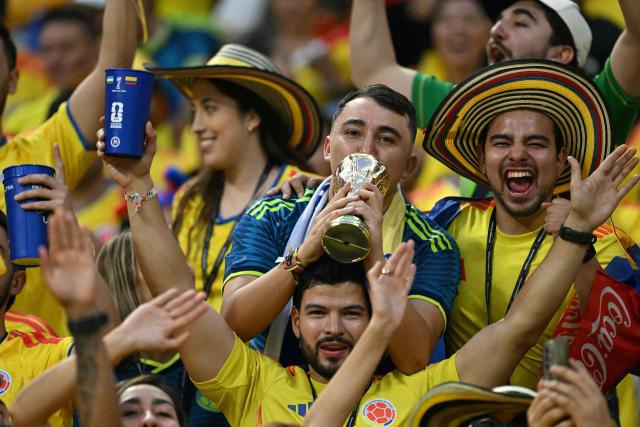 Colombian fans pose for a photo cheering for their team ahead of the 2026 World Cup Group K football match between Uzbekistan and Colombia at the Mexico City Stadium in Mexico City on June 17, 2026.  (Photo by Yuri CORTEZ / AFP)