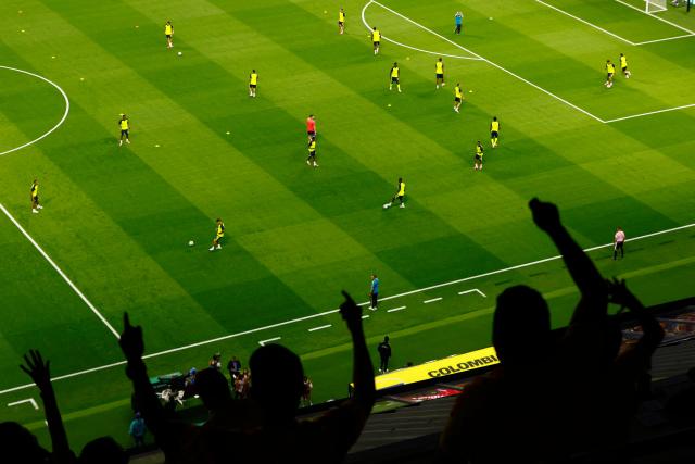 Colombia's players warm up as fans cheer for them ahead of the 2026 World Cup Group K football match between Uzbekistan and Colombia at the Mexico City Stadium in Mexico City on June 17, 2026.  (Photo by Rodrigo Oropeza / AFP)