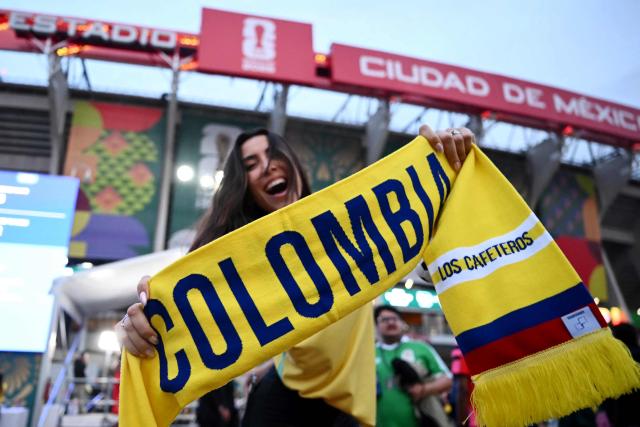 A fan shows a Colombian scarf outside the stadium ahead of the 2026 World Cup Group K football match between Uzbekistan and Colombia at the Mexico City Stadium in Mexico City on June 17, 2026.  (Photo by CARL DE SOUZA / AFP)