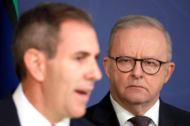 Australia’s Prime Minister Anthony Albanese (R) stands next to Australian Treasurer Jim Chalmers during a press conference regarding budget changes in Sydney on June 18, 2026. (Photo by DAVID GRAY / AFP)