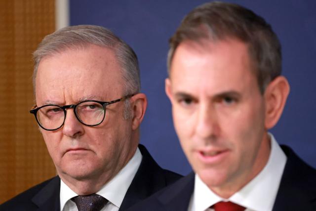 Australia’s Prime Minister Anthony Albanese (L) stands next to Australian Treasurer Jim Chalmers during a press conference regarding budget changes in Sydney on June 18, 2026. (Photo by DAVID GRAY / AFP)