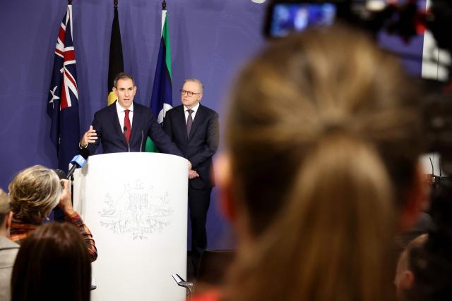Australia’s Prime Minister Anthony Albanese (R) stands next to Australian Treasurer Jim Chalmers during a press conference regarding budget changes in Sydney on June 18, 2026. (Photo by DAVID GRAY / AFP)