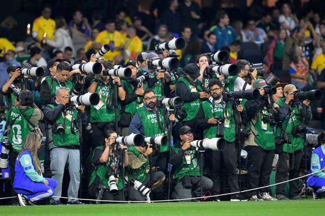 Photographers stand on the touchline ahead of the 2026 World Cup Group K football match between Uzbekistan and Colombia at the Mexico City Stadium in Mexico City on June 17, 2026.  (Photo by Alfredo ESTRELLA / AFP)