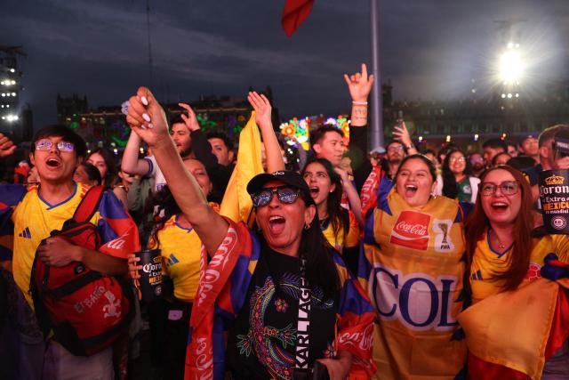 Colombia fans cheer for their team at the FIFA Fan Festival in Mexico City's Zocalo ahead of the 2026 World Cup Group K football match between Uzbekistan and Colombia on June 17, 2026. (Photo by LUIS CORTES / AFP)