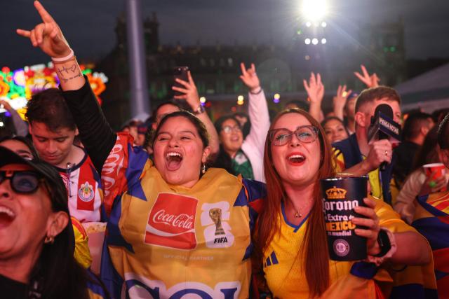 Colombia fans cheer for their team at the FIFA Fan Festival in Mexico City's Zocalo ahead of the 2026 World Cup Group K football match between Uzbekistan and Colombia on June 17, 2026. (Photo by LUIS CORTES / AFP)