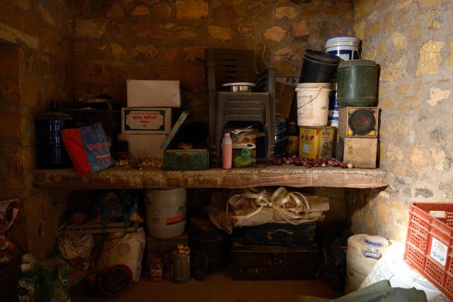 This photograph taken on May 29, 2026 shows a storage room inside herdsman Sawai Singh Bhati's house in Sanwata village on the outskirts of Rajasthan's Jaisalmer city. In India's hot plains, scorching summers have become increasingly harder to endure, requiring adaptations and forcing life into the hours of dark before the sun turns punishing. Temperatures in Singh's Sanwata village hit 45C in early June, as is often during the summer with the highest temperature recorded in the area as 49C. (Photo by Manan VATSYAYANA / AFP)