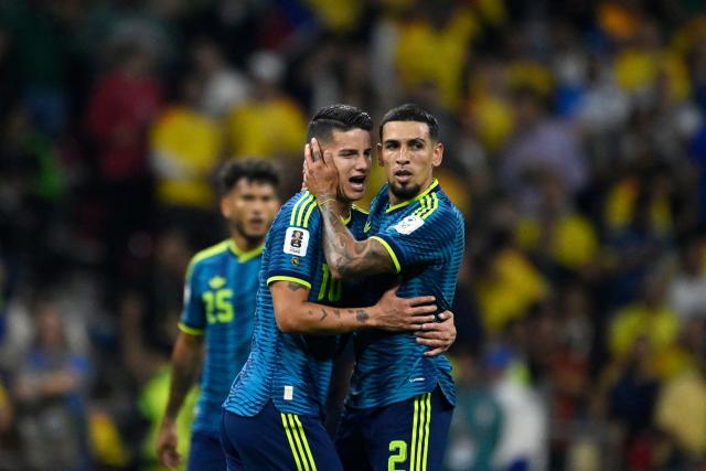 Colombia's defender #02 Daniel Munoz (R) celebrates after scoring his team's first goal with teammate midfielder #10 James Rodriguez during the 2026 World Cup Group K football match between Uzbekistan and Colombia at the Mexico City Stadium in Mexico City on June 17, 2026.  (Photo by Alfredo ESTRELLA / AFP)
