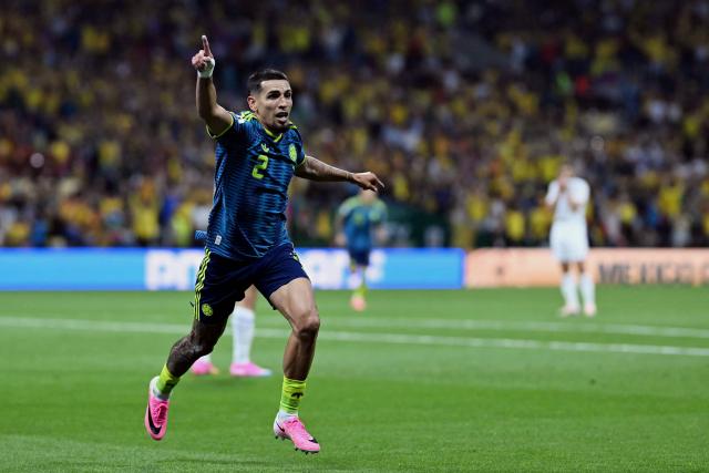 Colombia's defender #02 Daniel Munoz celebrates scoring his team's first goal during the 2026 World Cup Group K football match between Uzbekistan and Colombia at the Mexico City Stadium in Mexico City on June 17, 2026.  (Photo by CARL DE SOUZA / AFP)