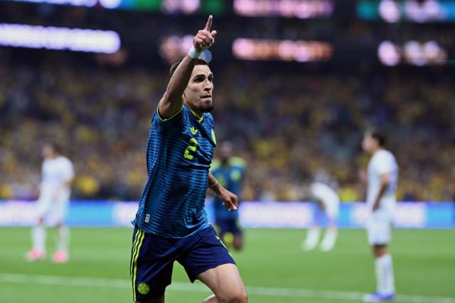 Colombia's defender #02 Daniel Munoz celebrates scoring his team's first goal during the 2026 World Cup Group K football match between Uzbekistan and Colombia at the Mexico City Stadium in Mexico City on June 17, 2026.  (Photo by CARL DE SOUZA / AFP)