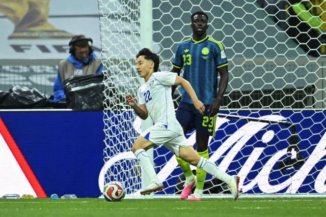 Uzbekistan's midfielder #22 Abbosbek Fayzullaev celebrates scoring his team's first goal during the 2026 World Cup Group K football match between Uzbekistan and Colombia at the Mexico City Stadium in Mexico City on June 17, 2026.  (Photo by Yuri CORTEZ / AFP)