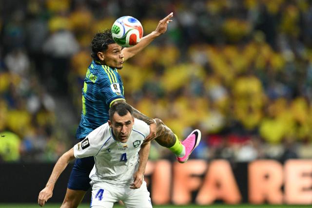 Colombia's midfielder #06 Richard Rios heads the ball past Uzbekistan's defender #04 Farrukh Sayfiev during the 2026 World Cup Group K football match between Uzbekistan and Colombia at the Mexico City Stadium in Mexico City on June 17, 2026.  (Photo by Yuri CORTEZ / AFP)