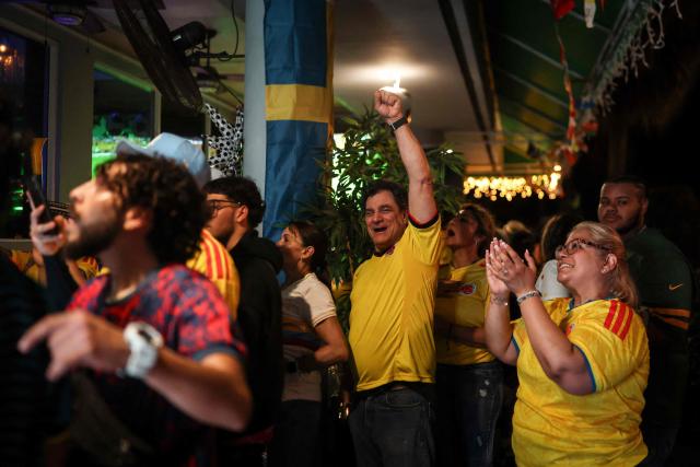 Colombian supporters celebrate at a sports bar in Miami, Florida, after the 2026 World Cup Group K football match between Uzbekistan and Colombia at Mexico City Stadium in Mexico City on June 17, 2026. (Photo by PATRICIA DE MELO MOREIRA / AFP)