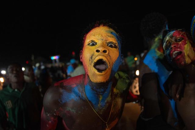 Congolese supporters dressed in the colors of the Democratic Republic of Congo's national flag celebrate the Leopards' equalizing goal in a street in Bunia at night during a FIFA World Cup match between DR Congo and Portugal in Bunia, Ituri Province, Democratic Republic of Congo, on June 17, 2026. Ituri, a remote province in northeastern Congo, is at the epicenter of the 17th Ebola outbreak, declared on May 15 in the DRC. The virus has infected 837 people and caused 196 deaths so far, according to the latest official figures.
In the city of Bunia alone, 215 cases of infection have been confirmed, while the DRCs testing capacity is limited. The scale of the health crisis is still unknown, scientists, aid workers, and international health authorities acknowledge.
But for 90 minutes of the match, some of the roughly 100 million inhabitants say they were able to escape the worries linked to the epidemic, the conflict in the east of the country, and the violence of armed groups. (Photo by Jospin Mwisha / AFP)