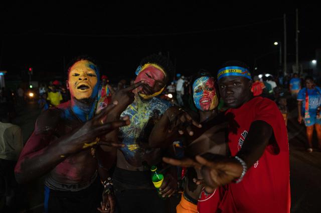 Congolese supporters dressed in the colors of the Democratic Republic of Congo's national flag celebrate the Leopards' equalizing goal in a street in Bunia at night during a FIFA World Cup match between DR Congo and Portugal in Bunia, Ituri Province, Democratic Republic of Congo, on June 17, 2026. Ituri, a remote province in northeastern Congo, is at the epicenter of the 17th Ebola outbreak, declared on May 15 in the DRC. The virus has infected 837 people and caused 196 deaths so far, according to the latest official figures.
In the city of Bunia alone, 215 cases of infection have been confirmed, while the DRCs testing capacity is limited. The scale of the health crisis is still unknown, scientists, aid workers, and international health authorities acknowledge.
But for 90 minutes of the match, some of the roughly 100 million inhabitants say they were able to escape the worries linked to the epidemic, the conflict in the east of the country, and the violence of armed groups. (Photo by Jospin Mwisha / AFP)