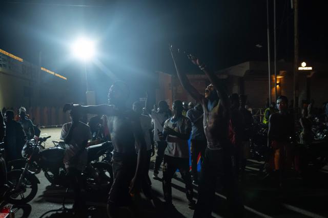 TOPSHOT - Congolese supporters celebrate the Democratic Republic of Congo's equalizing goal shortly before halftime during a FIFA World Cup match between DR Congo and Portugal in Bunia, Ituri Province, Democratic Republic of Congo, on June 17, 2026. Ituri, a remote province in northeastern Congo, is at the epicenter of the 17th Ebola outbreak, declared on May 15 in the DRC. The virus has infected 837 people and caused 196 deaths so far, according to the latest official figures.
In the city of Bunia alone, 215 cases of infection have been confirmed, while the DRCs testing capacity is limited. The scale of the health crisis is still unknown, scientists, aid workers, and international health authorities acknowledge.
But for 90 minutes of the match, some of the roughly 100 million inhabitants say they were able to escape the worries linked to the epidemic, the conflict in the east of the country, and the violence of armed groups. (Photo by Jospin Mwisha / AFP)