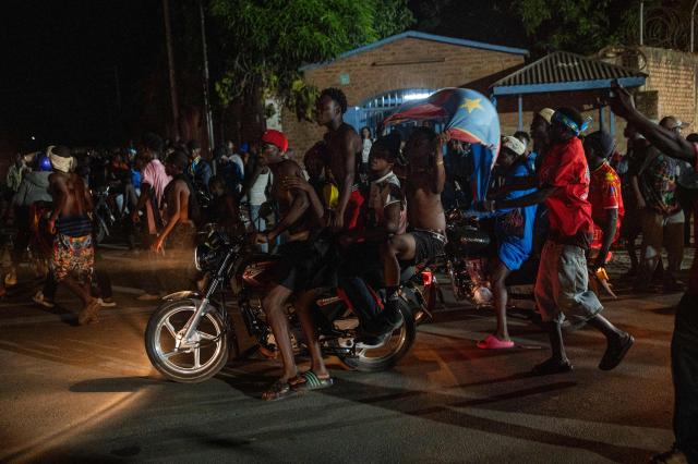 Congolese supporters celebrate the Democratic Republic of Congo's equalizing goal shortly before halftime during a FIFA World Cup match between DR Congo and Portugal in Bunia, Ituri Province, Democratic Republic of Congo, on June 17, 2026. Ituri, a remote province in northeastern Congo, is at the epicenter of the 17th Ebola outbreak, declared on May 15 in the DRC. The virus has infected 837 people and caused 196 deaths so far, according to the latest official figures.
In the city of Bunia alone, 215 cases of infection have been confirmed, while the DRCs testing capacity is limited. The scale of the health crisis is still unknown, scientists, aid workers, and international health authorities acknowledge.
But for 90 minutes of the match, some of the roughly 100 million inhabitants say they were able to escape the worries linked to the epidemic, the conflict in the east of the country, and the violence of armed groups. (Photo by Jospin Mwisha / AFP)