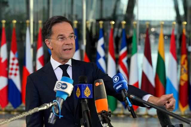 NATO Secretary General Mark Rutte makes a statement upon arriving to take part in a NATO Defence Ministers meeting at the NATO headquarters, in Brussels, on June 18, 2026. (Photo by JOHN THYS / AFP)