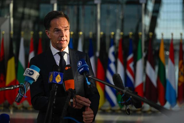 NATO Secretary General Mark Rutte makes a statement upon arriving to take part in a NATO Defence Ministers meeting at the NATO headquarters, in Brussels, on June 18, 2026. (Photo by JOHN THYS / AFP)