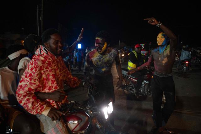 Congolese supporters dressed in the colors of the Democratic Republic of Congo's national flag celebrate the Leopards' equalizing goal in a street in Bunia at night during a FIFA World Cup match between DR Congo and Portugal in Bunia, Ituri Province, Democratic Republic of Congo, on June 17, 2026. Ituri, a remote province in northeastern Congo, is at the epicenter of the 17th Ebola outbreak, declared on May 15 in the DRC. The virus has infected 837 people and caused 196 deaths so far, according to the latest official figures.
In the city of Bunia alone, 215 cases of infection have been confirmed, while the DRCs testing capacity is limited. The scale of the health crisis is still unknown, scientists, aid workers, and international health authorities acknowledge.
But for 90 minutes of the match, some of the roughly 100 million inhabitants say they were able to escape the worries linked to the epidemic, the conflict in the east of the country, and the violence of armed groups. (Photo by Jospin Mwisha / AFP)