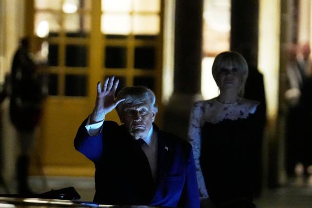 US President Donald Trump (c) walks to the presidential limousine alongside France's First Lady Brigitte Macron following a dinner marking the 250th anniversary of US independence at the Château de Versailles in Versailles, southwest of Paris, on June 17, 2026. (Photo by Michel Euler / POOL / AFP)