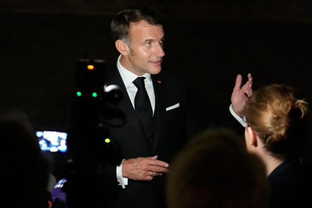 France's President Emmanuel Macron speaks to the press following a dinner marking the 250th anniversary of US independence at the Château de Versailles in Versailles, southwest of Paris, on June 17, 2026. (Photo by Michel Euler / POOL / AFP)