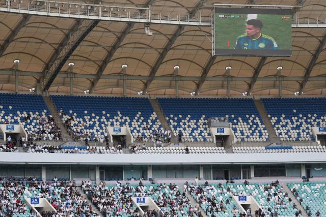 Uzbek fans watch a live broadcast of the 2026 World Cup Group K football match between Uzbekistan and Colombia at the Milliy Stadium in Tashkent on June 18, 2026. (Photo by Timur ISMOILOV / AFP)