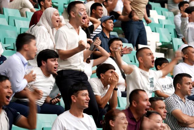 Uzbek fans react as they watch a live broadcast of the 2026 World Cup Group K football match between Uzbekistan and Colombia at the Milliy Stadium in Tashkent on June 18, 2026. (Photo by Timur ISMOILOV / AFP)
