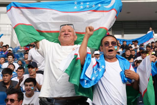 Uzbek fans react as they watch a live broadcast of the 2026 World Cup Group K football match between Uzbekistan and Colombia at the Milliy Stadium in Tashkent on June 18, 2026. (Photo by Timur ISMOILOV / AFP)