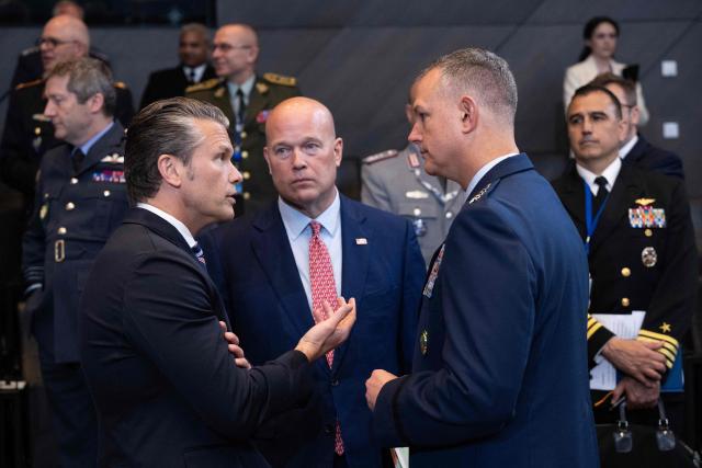 US Defense Secretary Pete Hegseth (L) and US Ambassador to NATO nominee Matthew Whitaker (C) speak before a NATO Defence Ministers meeting at the NATO headquarters, in Brussels, on June 18, 2026. (Photo by JOHN THYS / AFP)