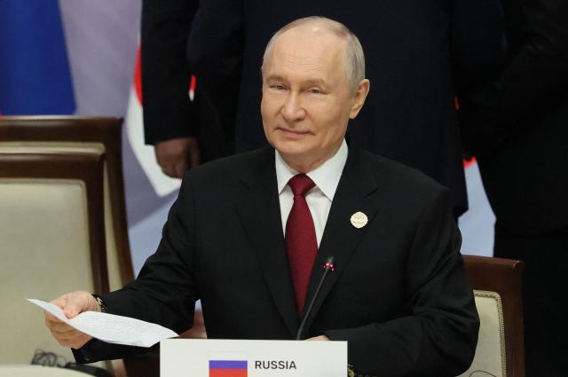 Russia's President Vladimir Putin attends a plenary session of the Russia-ASEAN summit, which commemorates 35 years of collaboration between Russia and the ASEAN countries, in the central Russian city of Kazan, around 700 kilometres (435 miles) east of the capital Moscow, on June 18, 2026. (Photo by Anastasia Barashkova / POOL / AFP)