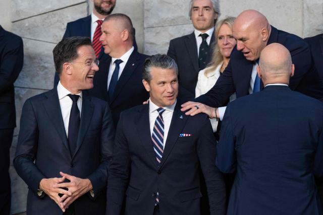 (From L) NATO Secretary General Mark Rutte reacts as Italy's Defence Minister Guido Crosetto (R) interacts with US Defense Secretary Pete Hegseth (C) during a family photograph on the sidelines of a NATO Defence Ministers meeting at the NATO headquarters, in Brussels, on June 18, 2026. (Photo by JOHN THYS / AFP)
