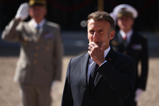 France's President Emmanuel Macron reacts during the commemorative ceremony for the 86th anniversary of the Appeal of 18 June, in Mont Valerien, near Paris, on June 18, 2026. (Photo by SIMON WOHLFAHRT / POOL / AFP)