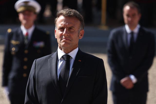 France's President Emmanuel Macron (C) and France's Prime Minister Sebastien Lecornu (R) attend commemorative ceremony for the 86th anniversary of the Appeal of 18 June, in Mont Valerien, near Paris, on June 18, 2026. (Photo by SIMON WOHLFAHRT / POOL / AFP)